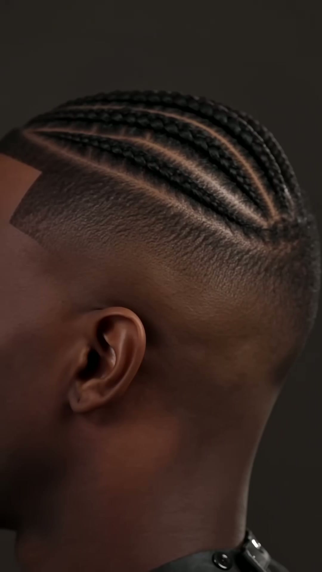 Side profile — clean skin fade with brushed back top